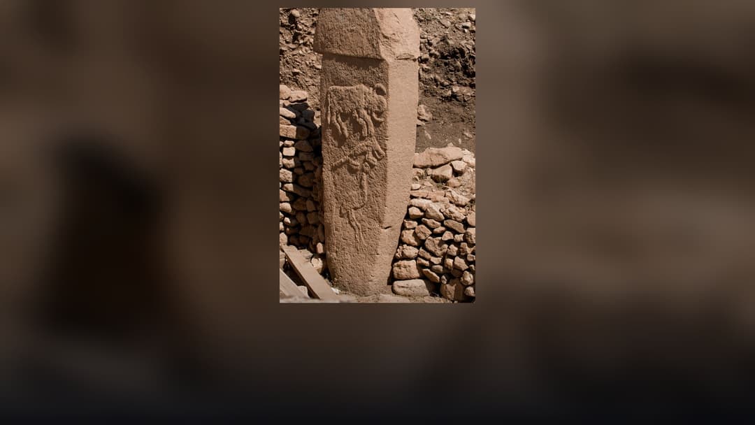 Massive circular megalithic stone enclosures and carved T-pillars at Göbekli Tepe.