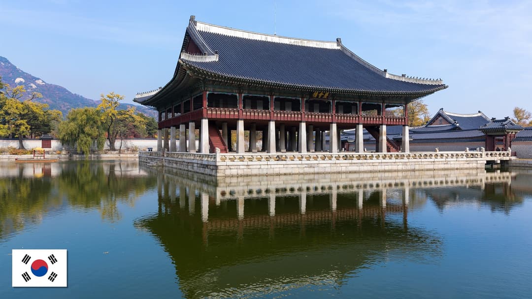 Gyeonghoeru Royal Banquet Hall at Gyeongbokgung Palace in Seoul, South Korea with the South Korean flag in the bottom left corner