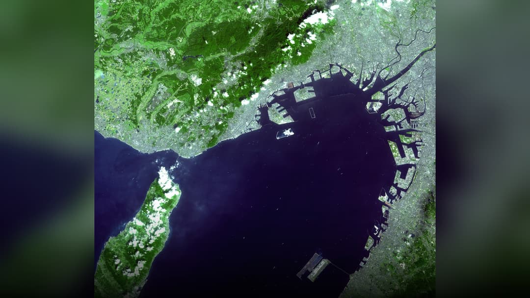 Orbital astronaut and satellite photography of Kansai International Airport.