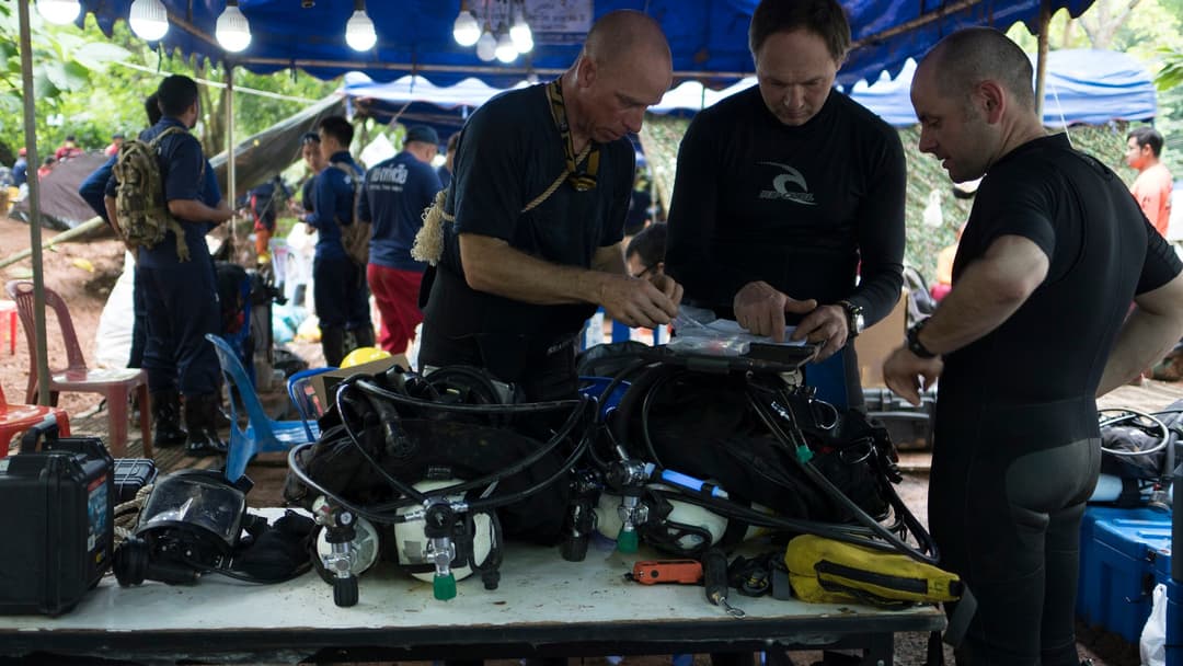 Rescue divers preparing equipment at Tham Luang cave in Thailand
