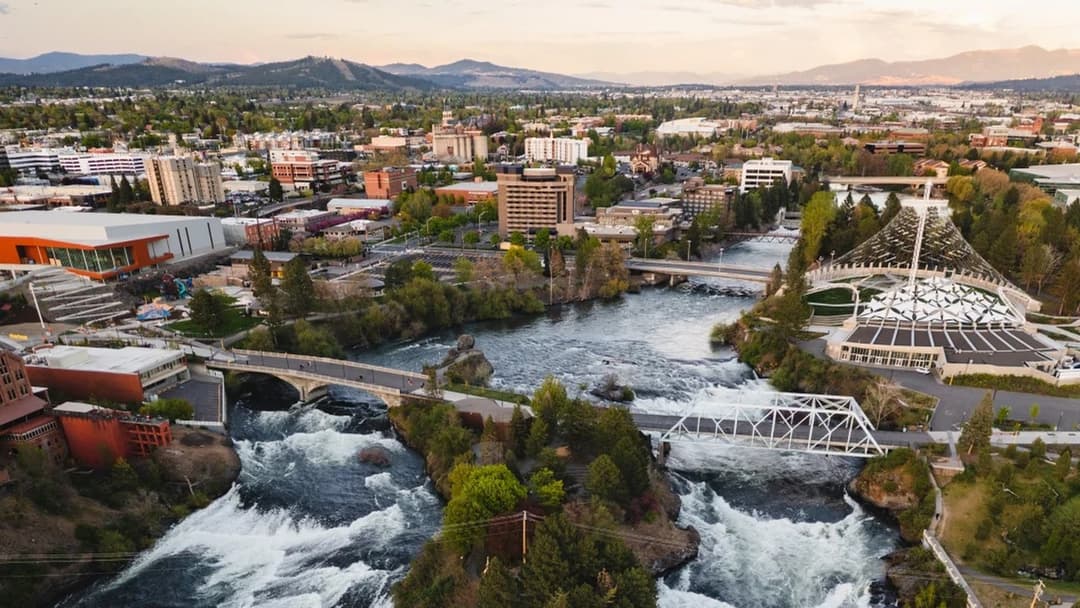 Scenic Spokane Falls rushing through the rocky urban canyon in downtown Spokane, Washington.